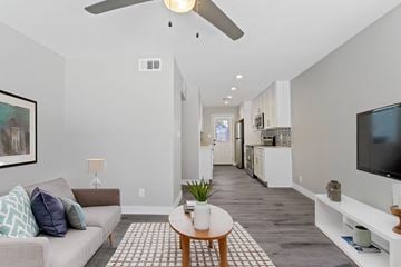 Phoenix apartment for rent - a living room with a couch and a coffee table and a tv