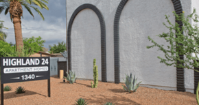 Phoenix apartment for rent - A sign for Highland 24 Apartment Home is in front of a white building.