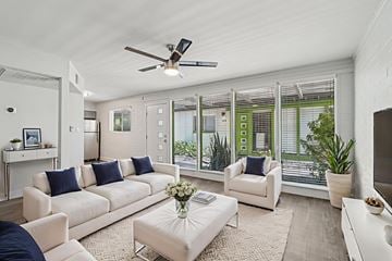 Scottsdale apartment for rent - A living room with a white couch and a ceiling fan.