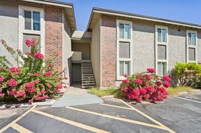 Tempe apartment for rent - A building with a parking lot in front of it.