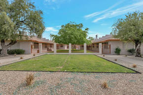 Phoenix apartment for rent - a yard in front of a house with a lawn and trees