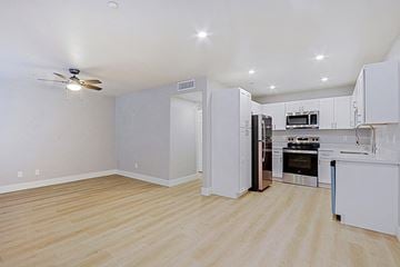 Phoenix apartment for rent - a renovated kitchen with white cabinets and stainless steel appliances