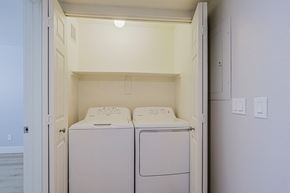 Phoenix apartment for rent - a washer and dryer in a laundry room with white walls