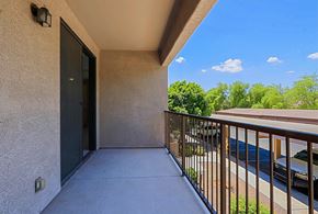 Chandler apartment for rent - the spacious balcony has a view of the parking lot and the trees