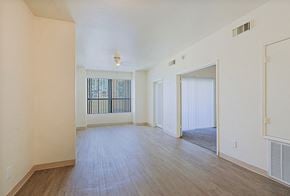 Yuma apartment for rent - the living room and dining room of an apartment with wood flooring