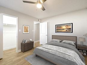 Tempe apartment for rent - a bedroom with a bed and a ceiling fan