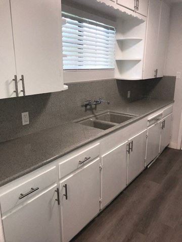 Phoenix apartment for rent - a kitchen with white cabinets and a sink