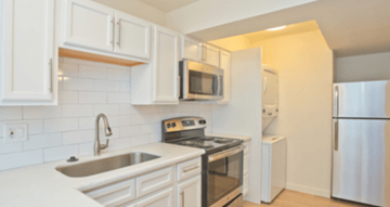 Phoenix apartment for rent - A kitchen with white cabinets and appliances.
