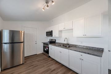 Phoenix apartment for rent - a kitchen with stainless steel appliances and white cabinets