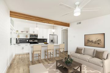 Scottsdale apartment for rent - a living room with a couch and a kitchen with a table