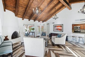 Scottsdale apartment for rent - A living room with a fireplace and a painting on the wall.