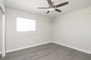 Phoenix apartment for rent - an empty room with a ceiling fan and a window