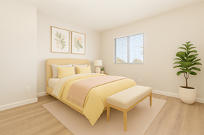 Phoenix apartment for rent - A bedroom with a bed, bench, and two framed pictures on the wall.