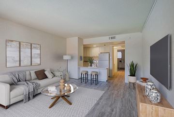 Phoenix apartment for rent - A living room with a grey couch and a coffee table.