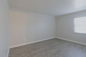 Phoenix apartment for rent - a bedroom with hardwood floors and a window at Allora Phoenix Apartments, Arizona, 85021