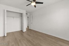 Phoenix apartment for rent - an empty bedroom with a ceiling fan and a closet