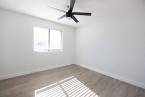 Phoenix apartment for rent - an empty room with a ceiling fan and a window