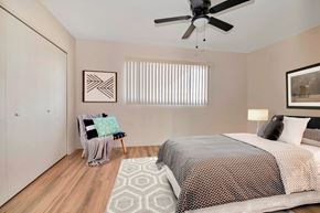 Phoenix apartment for rent - a bedroom with a bed and a ceiling fan