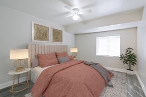 Phoenix apartment for rent - a bedroom with a bed and a ceiling fan