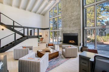 Flagstaff apartment for rent - a living room with couches and chairs and a fireplace