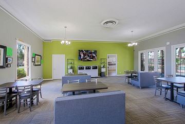 Phoenix apartment for rent - a living room with tables and chairs and a television