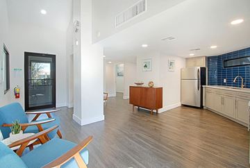 Mesa apartment for rent - a kitchen and living room with a refrigerator and a table and chairs
