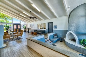 Phoenix townhouse for rent - a living room with a fireplace and a table and chairs