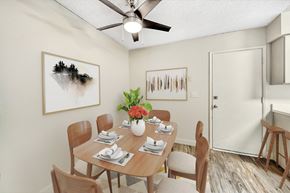 Phoenix townhouse for rent - A dining room with a table set for six and two chairs at Connect on Missour Apartments, Phoenix, Arizona