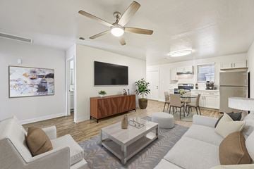 Mesa apartment for rent - A living room with a grey sofa, a coffee table and a television.