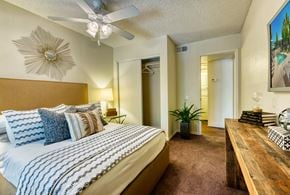 Glendale apartment for rent - a bedroom with a large bed and a ceiling fan at Connect on Northern, Glendale Arizona