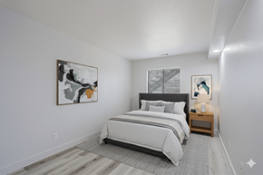 Phoenix apartment for rent - A bedroom with a large bed and a painting on the wall.