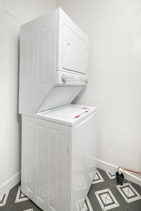Scottsdale apartment for rent - a white washer and dryer in a white room with a tiled floor