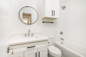 Scottsdale apartment for rent - a white bathroom with a white sink and toilet and a bath tub