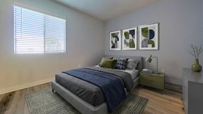 Phoenix apartment for rent - A bedroom with a bed, nightstand, and a window with blinds.