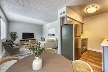Mesa apartment for rent - A living room with a grey couch and a wooden coffee table.