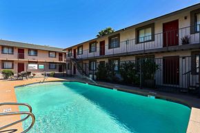 Phoenix apartment for rent - A swimming pool in front of apartment buildings.
