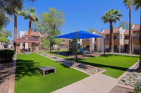 Phoenix apartment for rent - A sunny day at the community park with a gazebo and a playground.