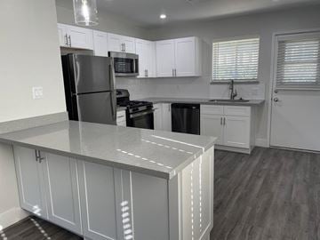 Phoenix apartment for rent - a kitchen with white cabinets and a counter top