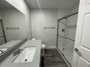 Phoenix apartment for rent - a bathroom with a sink and a shower and a toilet