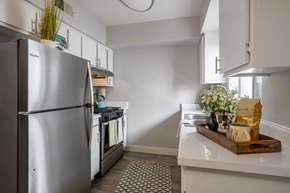 Phoenix apartment for rent - a kitchen with stainless steel appliances and white cabinets