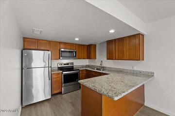 Phoenix apartment for rent - a kitchen with stainless steel appliances and granite counter tops