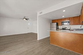 Phoenix apartment for rent - an empty living room with a kitchen and a counter top