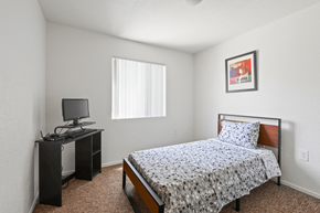 Yuma apartment for rent - a bedroom with a bed and a desk