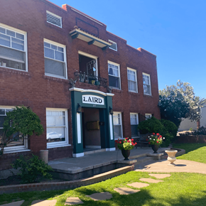 Phoenix apartment for rent - a red brick building with a sign that reads laird