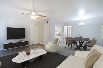 Phoenix apartment for rent - a living room and dining room with a tv and a table