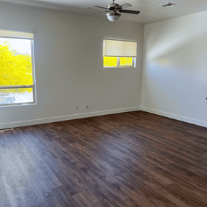 Scottsdale apartment for rent - an empty living room with wooden floors and a ceiling fan
