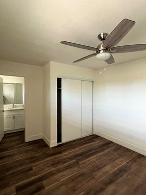Phoenix apartment for rent - a bedroom with a closet and a ceiling fan