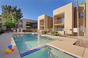 Mesa apartment for rent - a swimming pool with a beach ball in front of a building