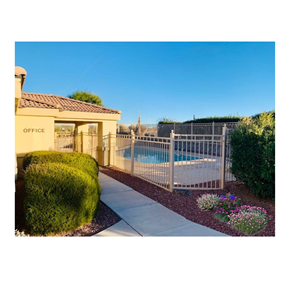 Huachuca City apartment for rent - an aluminum fence with a pool in front of a house