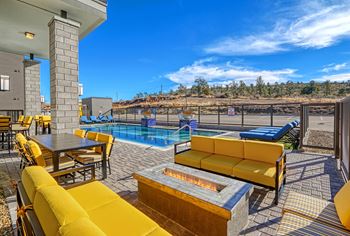 Clubhouse with pool and patio furniture